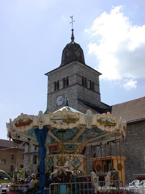 Bell tower and carousel in Clairvaux-les-Lacs, Franche-Comté, France