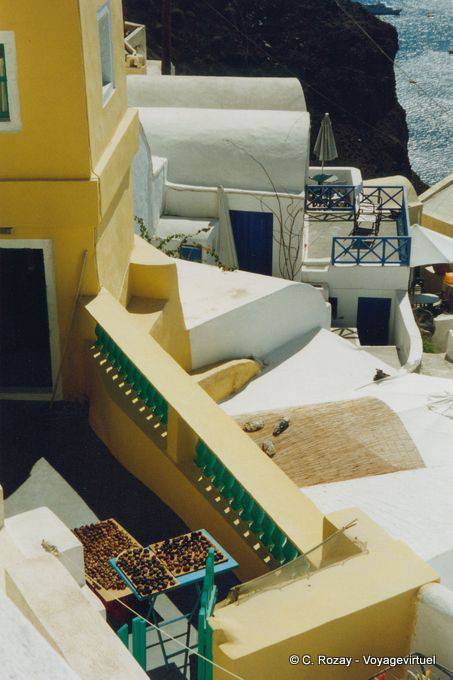 Houses clinging to the cliff, Oia, Santorini - Greece