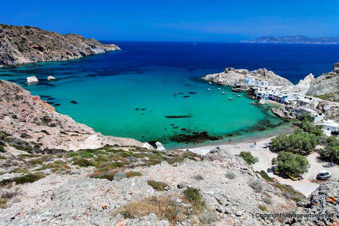 Milos, Firopotamos, panorama of the bay, the beach and the fishing village - Greece