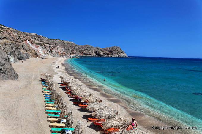 Milos, Paleohori, deckchairs on the sand - Greece