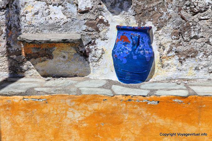 Milos, Plaka, pottery embedded in a wall - Greece