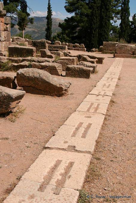 Blocks foot on stage, Delphi - Greece