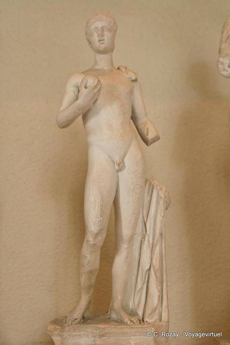 Naked man statue holding a ball, Archaeological Museum of Epidaurus - Greece