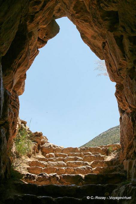 Corbelled arched entrance of the stairs down to a tank, Mycenae - Greece