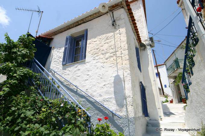House on ascending the heights of the city, Poros - Greece