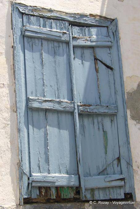 The dilapidated window shutters, Poros - Greece