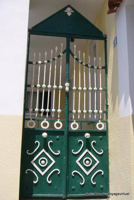 Door green and white iron, Poros - Greece