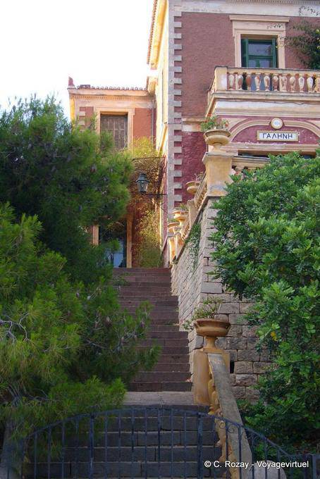 Stairs to typical neoclassical pink house Poros - Greece