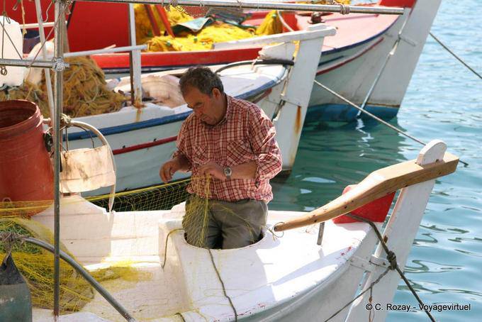 Fisherman mending nets, Poros - Greece