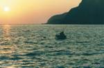Fisherman at sunset, island of Anafi, Greece.
