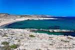 Pink sand beach, views to Mytakas Milos, Greece.
