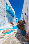 Milos, Plaka, typical alley and blue balcony, Greece.
