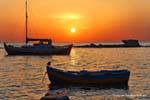 Milos, Pollonia, boats at sunset, Greece.
