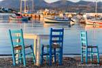 Milos, Pollonia, chairs history of the harbor, Greece.