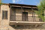Balcony facade stones, Afissos, Pelion, Greece.