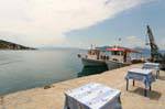 Tables on the port, Trikeri, Agia Kyriaki, Greece.