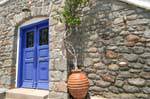 Door and stone wall, Poros, Greece.