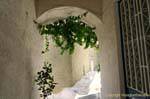 Passage under arch, Poros, Greece.