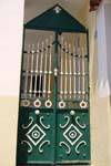 Door green and white iron, Poros, Greece.