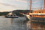 Wooden schooner and mini ferry, Poros, Greece.
