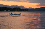 Fishing boat in the evening light, Poros, Greece.