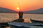 Fishermen at sunset, Sounion, Attica, Greece.