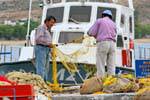 Serifos, Livadi, untangling nets, Greece.