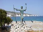 The statue of Kosmas Barbatsis before the cannons, Spetses, Greece.