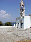 Bell tower and entrance to the monastery Agios Nikolaos, Spetses, Greece.