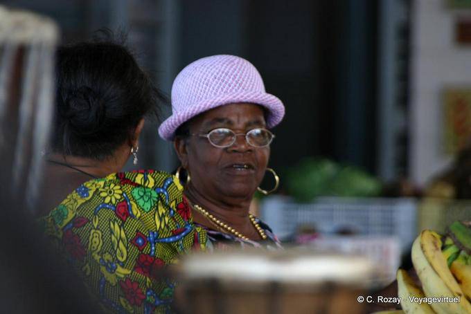 Merchant wearing a purple hat, Basse-Terre market - Guadeloupe