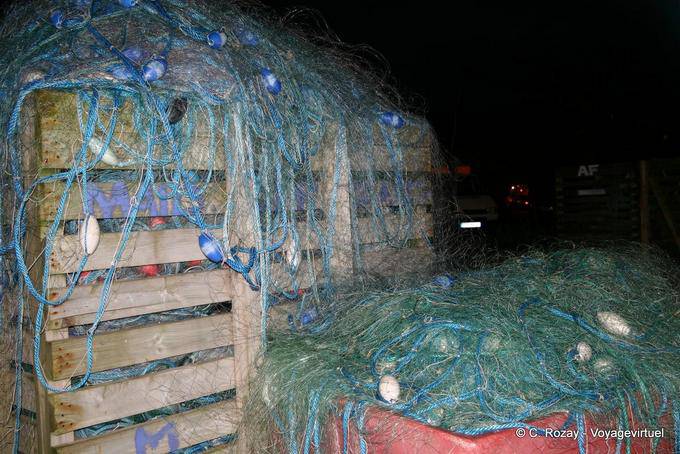 Stack of nets on the harbor at night, Dingle - Ireland