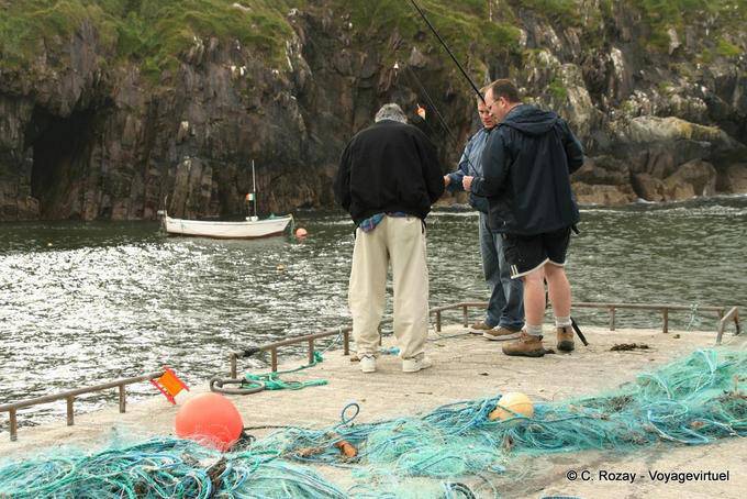 Fishermen on the pier in Brandon Creek, Ballycurrane, Dingle - Ireland