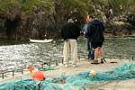 Fishermen on the pier in Brandon Creek, Ballycurrane, Dingle, Ireland.