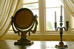 Mirror and candle in the window, Muckross House, Killaney, Ireland.