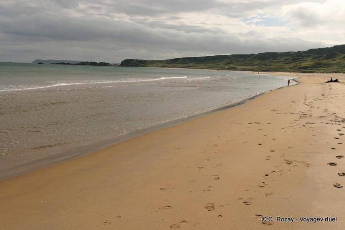 Solitary walker on the beach, White Park Bay - Nothern Ireland