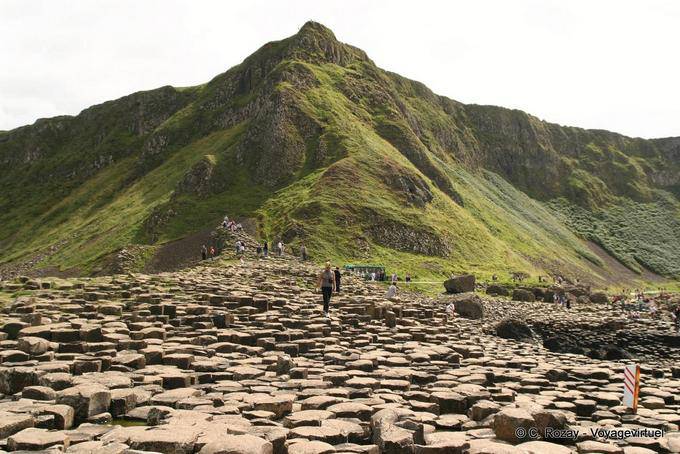 Walking on the pavement of the road, Giants Causeway - Nothern Ireland