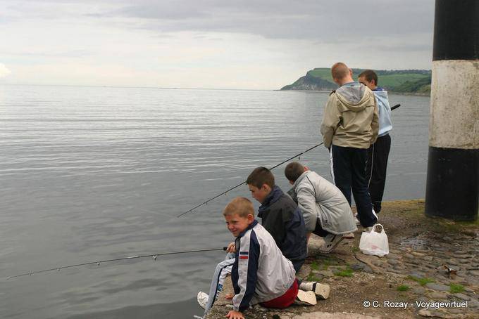 The kids fishing on the dam Carnlough - Nothern Ireland