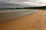 Solitary walker on the beach, White Park Bay, Nothern Ireland.