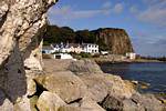 Houses between the cliffs of Port Braddan, White Park Bay, Nothern Ireland.