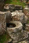 Column remains filled with water, Giants Causeway, Nothern Ireland.