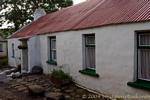 Typical low house with tin roof, near Fairhead, Nothern Ireland.