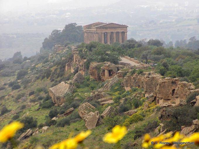 Temple in the mist, panorama of Agrigento - Italy