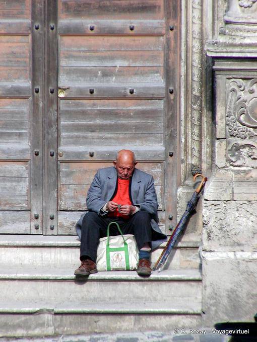 Man waiting at the umbrella, Caltagirone, Sicily - Italy