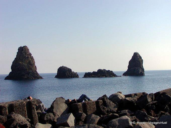 Nap in volcanic lava into chaos islands, Acci Trezza, Sicily - Italy