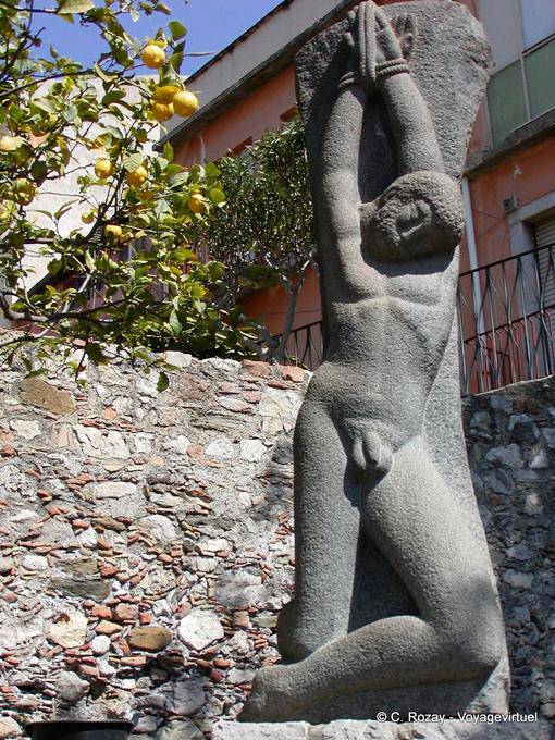 Statue of naked tortured, Taormina - Italy