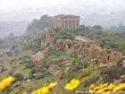 Temple in the mist, panorama of Agrigento, Italy.