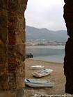 Fishing boats on the beach in Cefalu, Italy.