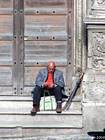 Man waiting at the umbrella, Caltagirone, Sicily, Italy.