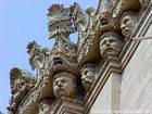 Stone heads in Piazza Duomo, Syracuse, Sicily, Italy.