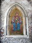 Pious image in the Clock Tower, Taormina, Italy.